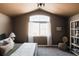 Inviting bedroom featuring neutral tones, a large window with curtains, and a cozy, stylish aesthetic at 2741 Sunset Way, Erie, CO 80516