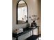 Entryway featuring a stylish mirror, decorative vase, and a sleek black table at 2741 Sunset Way, Erie, CO 80516