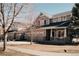 Inviting two-story home featuring a three-car garage and charming front porch at 2741 Sunset Way, Erie, CO 80516