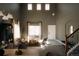 Bright living room featuring high ceilings, lots of natural light, contemporary furnishings, and modern design at 2741 Sunset Way, Erie, CO 80516