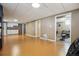 Expansive basement area with kitchenette, and a doorway leading to home gym at 2060 S Lowell Blvd, Denver, CO 80219