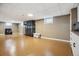 Finished basement with recessed lighting, neutral walls, and tile flooring at 2060 S Lowell Blvd, Denver, CO 80219