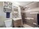 Stylish remodeled bathroom with new vanity, mosaic tile details, and modern fixtures at 2060 S Lowell Blvd, Denver, CO 80219