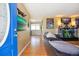 Inviting entryway to a living room featuring hardwood floors, modern decor, and bright natural light at 2060 S Lowell Blvd, Denver, CO 80219