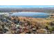 Panoramic aerial view showcasing a serene lake surrounded by lush greenery and charming residential neighborhoods at 4215 W Byron Pl, Denver, CO 80212