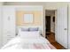 Comfortable bedroom featuring built-in storage and hardwood floors at 4215 W Byron Pl, Denver, CO 80212