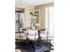 Chic dining area with round table, plush chairs, and stylish decor, perfect for gatherings at 4215 W Byron Pl, Denver, CO 80212