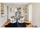 Cozy dining room with stylish decor, open to the kitchen, perfect for Gathering meals at 4215 W Byron Pl, Denver, CO 80212