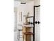 Charming breakfast nook with breakfast bar, two chairs, and decorative tile backsplash at 4215 W Byron Pl, Denver, CO 80212