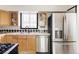 Functional kitchen features stainless steel appliances and ample cabinet storage at 4215 W Byron Pl, Denver, CO 80212