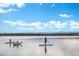 People enjoying water activities like paddleboarding on a sunny day with mountain views at 4215 W Byron Pl, Denver, CO 80212