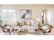 Cozy living room featuring a stylish sofa, elegant decor, and abundant natural light, perfect for relaxation at 4215 W Byron Pl, Denver, CO 80212