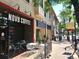 Exterior shot of Novo Coffee with outdoor seating. The building has large glass windows at 4215 W Byron Pl, Denver, CO 80212