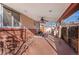 Spacious covered patio featuring stamped concrete, ceiling fan, and outdoor dining area for outdoor enjoyment at 4215 W Byron Pl, Denver, CO 80212