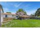Spacious backyard featuring a well-maintained lawn and a covered patio perfect for outdoor entertaining at 7276 W 83Rd Way, Arvada, CO 80003
