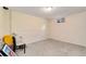 Carpeted basement area with a single window, offering potential for a home office or recreation space at 7276 W 83Rd Way, Arvada, CO 80003