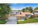 Charming two-story home with brick accents, a well-manicured lawn, and a two-car garage at 7276 W 83Rd Way, Arvada, CO 80003