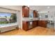 Well-lit kitchen featuring cherry cabinets, stainless steel appliances, and a bright window over the sink at 7276 W 83Rd Way, Arvada, CO 80003