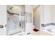 Large bathroom with a walk-in shower and a separate tub at 11828 Churchfield St, Parker, CO 80134