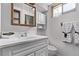 Bathroom sink with white vanity, neutral paint, and a window for natural light at 7720 Kendall St, Arvada, CO 80003