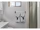 Bathroom with neutral paint, decorative towel rack, and shower behind a curtain at 7720 Kendall St, Arvada, CO 80003