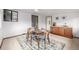 Bright dining area with wood table and chairs, with extra cabinet space at 7720 Kendall St, Arvada, CO 80003