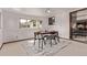 Stylish dining room with modern furniture and a decorative rug, a bright space at 7720 Kendall St, Arvada, CO 80003