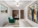 Well-lit home office with a stylish desk, art, and comfortable seating, perfect for working from home at 7720 Kendall St, Arvada, CO 80003