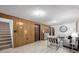 Finished basement living room with a modern aesthetic and comfortable seating at 7720 Kendall St, Arvada, CO 80003