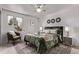 Serene bedroom featuring stylish decor, cozy textiles, and ample natural light at 7720 Kendall St, Arvada, CO 80003