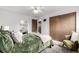 Cozy bedroom with a plush bed, decorative mirror and a comfortable chair at 7720 Kendall St, Arvada, CO 80003