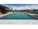 Community pool, partially covered, with lounge chairs and umbrellas for a relaxing experience at 24285 E Wagon Trail Ave, Aurora, CO 80016