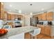Modern kitchen with stainless steel appliances, granite countertops, and an island with bar seating at 24285 E Wagon Trail Ave, Aurora, CO 80016