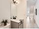 Bathroom featuring modern fixtures, a decorative mirror, and sleek design at 374 North Geneva, Aurora, CO 80010