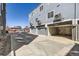 Row of attached garages featuring individual units with gray doors and modern exterior design at 374 North Geneva, Aurora, CO 80010