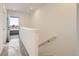 Hallway leading to an outdoor balcony, featuring a modern staircase and plenty of natural light at 374 North Geneva, Aurora, CO 80010