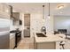 Modern kitchen with granite countertops, stainless steel appliances, and pendant lighting at 374 North Geneva, Aurora, CO 80010
