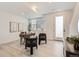 Bright office space with sleek desk, modern art, and light wood flooring for a serene work environment at 374 North Geneva, Aurora, CO 80010