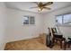 Clean, neutral bedroom with two windows providing natural light and carpeted flooring at 8221 Ralph Ln, Denver, CO 80221