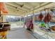 Covered outdoor patio area with space for dining and entertaining, plus decor and BBQ at 8221 Ralph Ln, Denver, CO 80221