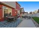 The cozy backyard features a patio with outdoor seating for dining at 315 Painted Horse Way, Erie, CO 80516