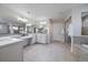 Bright bathroom with a double vanity, large mirrors, and a glass shower at 315 Painted Horse Way, Erie, CO 80516