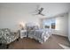 Comfortable bedroom with a ceiling fan and ample natural light at 315 Painted Horse Way, Erie, CO 80516