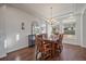 Elegant dining room featuring a chandelier and large windows at 315 Painted Horse Way, Erie, CO 80516