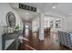 Inviting entryway featuring hardwood floors and an open floor plan at 315 Painted Horse Way, Erie, CO 80516