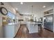 Modern kitchen featuring an island, updated cabinets and countertops at 315 Painted Horse Way, Erie, CO 80516