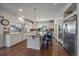 Bright kitchen with an island, granite countertops, and stainless appliances at 315 Painted Horse Way, Erie, CO 80516