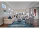 Comfortable living area with ample seating and neutral decor at 315 Painted Horse Way, Erie, CO 80516