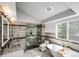 Beautiful bathroom featuring a soaking tub, glass shower, and modern fixtures at 18572 E Tanforan Pl, Aurora, CO 80015