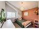 Charming bedroom with a vaulted ceiling, a cozy bed, and a bright window at 18572 E Tanforan Pl, Aurora, CO 80015